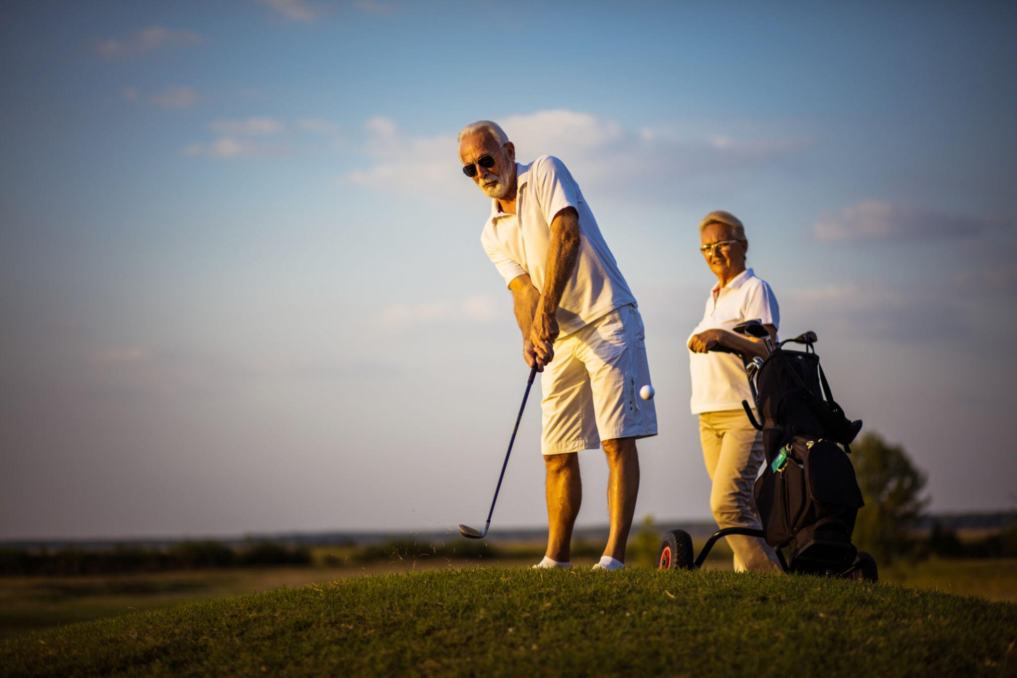 Couple Golfing Active older adults enjoying golf